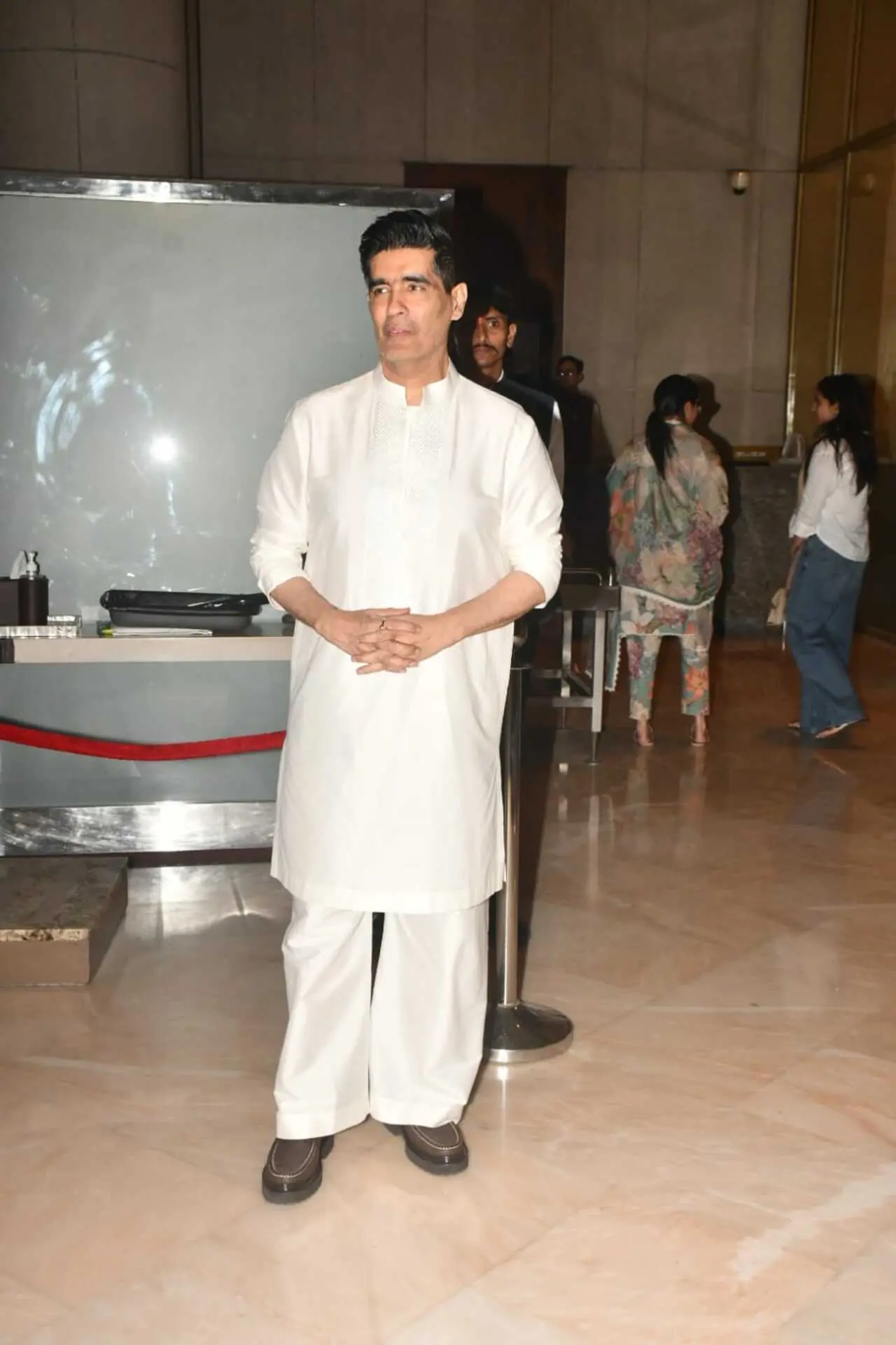 Manish Malhotra was seen meeting the paps stationed outside the prayer meet held for his late mother.